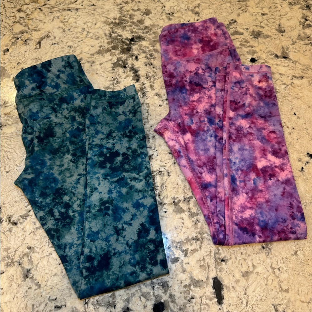 Two pairs of girls Athleta high rise printed chit chat leggings size L/12
